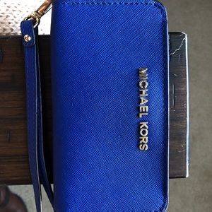 Authentic Michael Kors blue wallet with wrist wrap